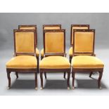 A set of 6 French rosewood Empire dining chairs, the seats and backs upholstered in yellow material,