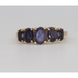 A 9ct yellow gold blue gem set ring 2.7 grams, size H