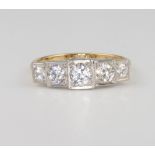 An 18ct yellow gold and platinum 5 stone graduated diamond ring, size N