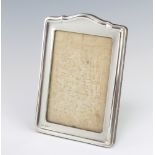 A silver photograph frame with arched top Birmingham 1947, 19cm