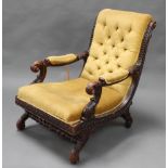 A 19th Century Continental heavily carved ebonised oak show frame open arm chair upholstered in