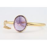 A 15ct yellow gold amethyst bangle 18.5 grams