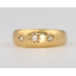 An 18ct yellow gold 3 stone diamond ring, 3.7 grams, size Q