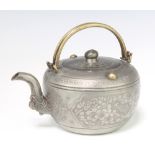 An early 20th century Chinese pewter tea pot with floral decoration