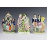 A Victorian Staffordshire watch holder supported by 3 ladies 28cm, a ditto of a couple holding