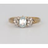 A 9ct yellow gold diamond and aquamarine ring, 2 grams, size L