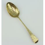 A Victorian silver gilt dessert spoon with chased decoration London 1845, 40 grams