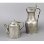 A 17th/18th Century Continental pewter lidded jug with acorn thumb piece, old repair, marked MC