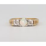 An 18ct yellow gold opal and diamond ring 4.2 grams, size O 1/2