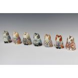 Seven Rye Pottery figures of seated dressed cats with painted eyes 8cm