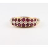 A 9ct yellow gold ruby and diamond ring size Q