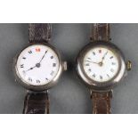 Two lady's silver cased wristwatches on leather straps Both dials are damaged and neither watch is