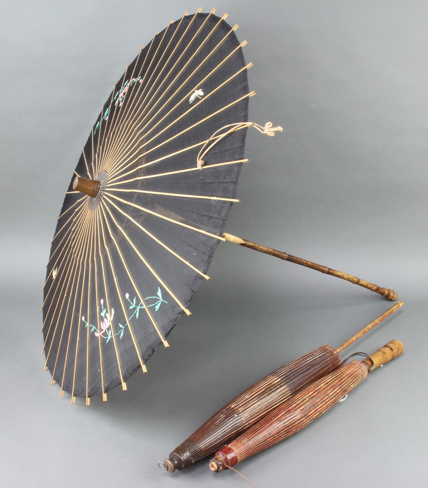 Three 1920's bamboo and wicker parasols