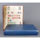 A Nelson stamp album of used world stamps including GB, Germany, France, USA together with a blue