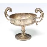 A silver 2 handled cup with scroll handles Chester 1927, 160 grams, 12cm The stem is dented and