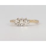 A 9ct yellow gold diamond ring, 1.8 grams, size K