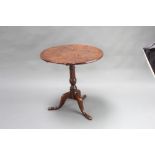An 18th Century elm snap top tea table, raised on a turned column and tripod base, 68cm h x 66cm