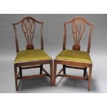 A pair of 19th Century Hepplewhite style mahogany slat back dining chairs with upholstered drop in