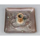 A Newlyn style square embossed copper chamber stick decorated dolphins 4cm x 14cm x 14cm Hole to the