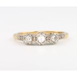 An 18ct yellow gold 3 stone diamond ring, 3.1 grams, size M