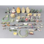 A collection of Britains lead farmyard animal figures, haystacks, windmill etc