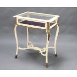 An Edwardian white and gilt painted rectangular bijouterie table with hinged lid, raised on cabriole