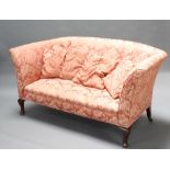 A 1920's Georgian style sofa upholstered in pink floral material raised on cabriole supports 85cm