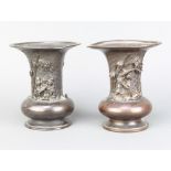 A pair of Chinese club shaped bronze vases, the body with 3 dimensional figural decoration, the base