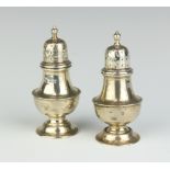 A pair of Victorian silver pepperettes Sheffield 1898 8.5cm h, 67 gramsSlight dents and some