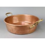 A circular copper preserving pan with brass twin handles 12cm x 43cm