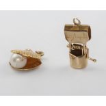 A 9ct yellow gold wishing well charm and a ditto oyster charm, 2 grams
