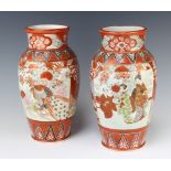 A pair of early 20th Century Kutani baluster vases decorated with panels of figures 31cm