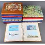 A collection of albums of 1960's, 70's and 80's coloured postcards of commercial airlines