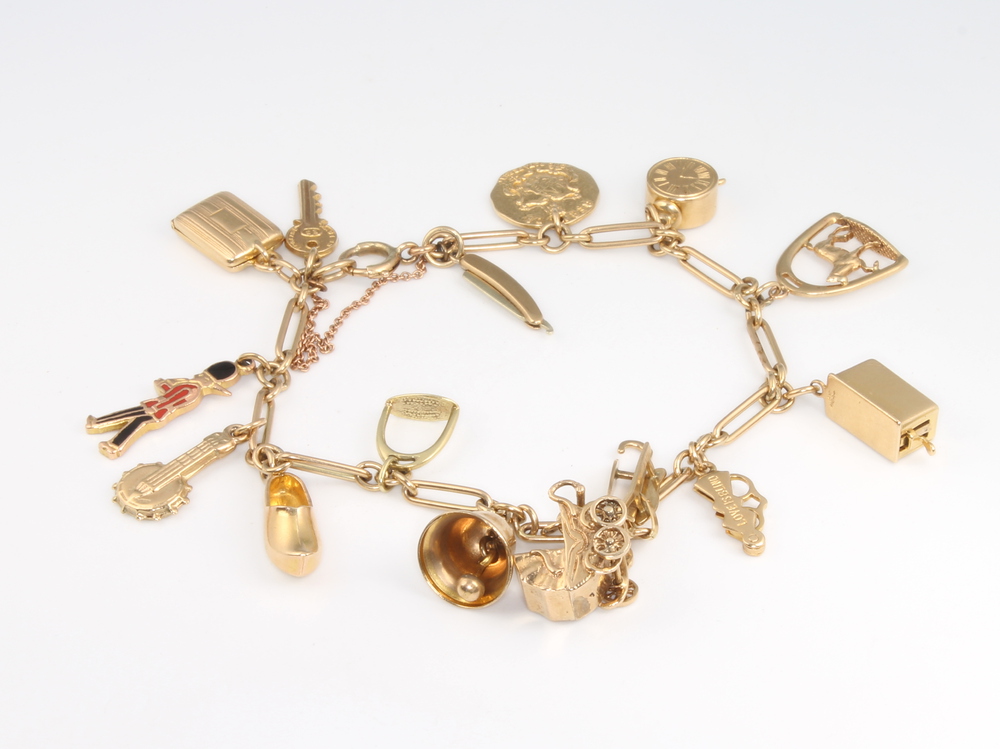 A 9ct yellow gold charm bracelet, 26.6 grams