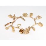 A 9ct yellow gold charm bracelet, 26.6 grams