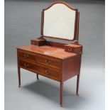 An Edwardian inlaid mahogany dressing table with arched shaped mirror, the base fitted 2 glove