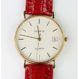 A gentleman's 9ct yellow gold Geneve calendar quartz wristwatch on a leather strap The watch is