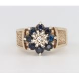 A 9ct yellow gold sapphire and diamond cluster ring 6.1 grams, size M