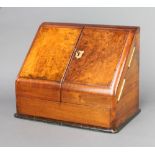 A Victorian walnut wedge shaped stationery box with stepped and fitted interior, the base with