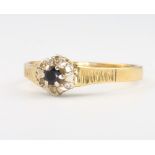 An 18ct yellow gold sapphire and diamond cluster ring, 3.1 grams, size S 1/2