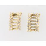 A pair of 9ct yellow gold diamond earrings, 1.8 grams