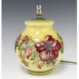 A Moorcroft yellow ground globular table lamp decorated with Hibiscus design, the base with
