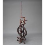 A 19th Century elm spinning wheel with later parts 96cm x 29cm x 43cm