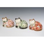 Three Rye Pottery figures of reclining cats, 2 dressed in suits with floral decoration and a