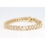 A 9ct yellow gold diamond bracelet, 17.6 grams, 18cm