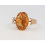 A 14ct yellow gold citrine and diamond ring size M