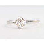 An 18ct white gold 4 stone diamond ring, 2 grams, size O