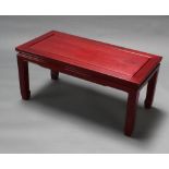 A Chinese rectangular hardwood coffee table raised on square supports 41cm h x 91cm w x 45cm d