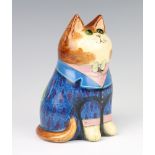 A Rye Pottery cat by Joan and David De Bethel, with glass eyes, dated 1982, wearing a frock coat