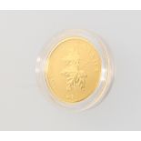 A 2014, 24ct gold maple leaf Canada 10 dollars coin, 7.7 grams